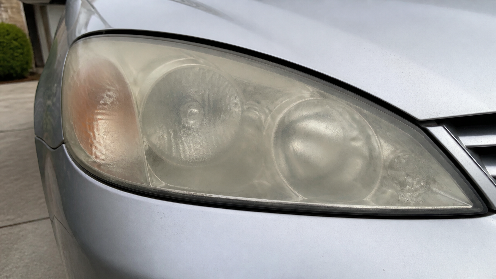 Cloudy oxidized headlight before restoration